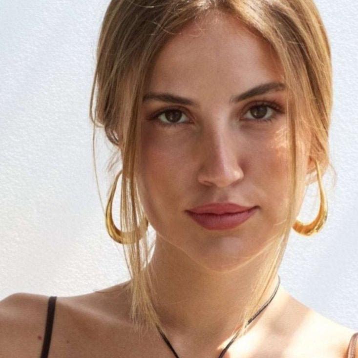 Model in 18k gold fill oval hoops