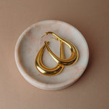 Ruben Drops in gold in a dish