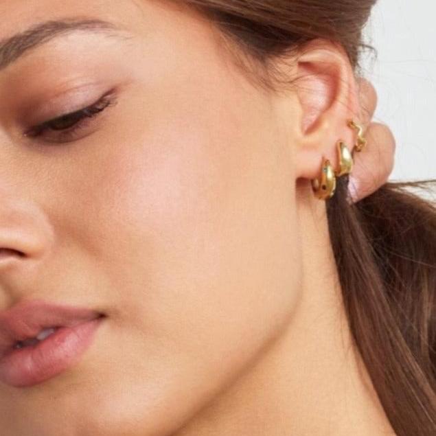 Model in Bixby and Co earring stack