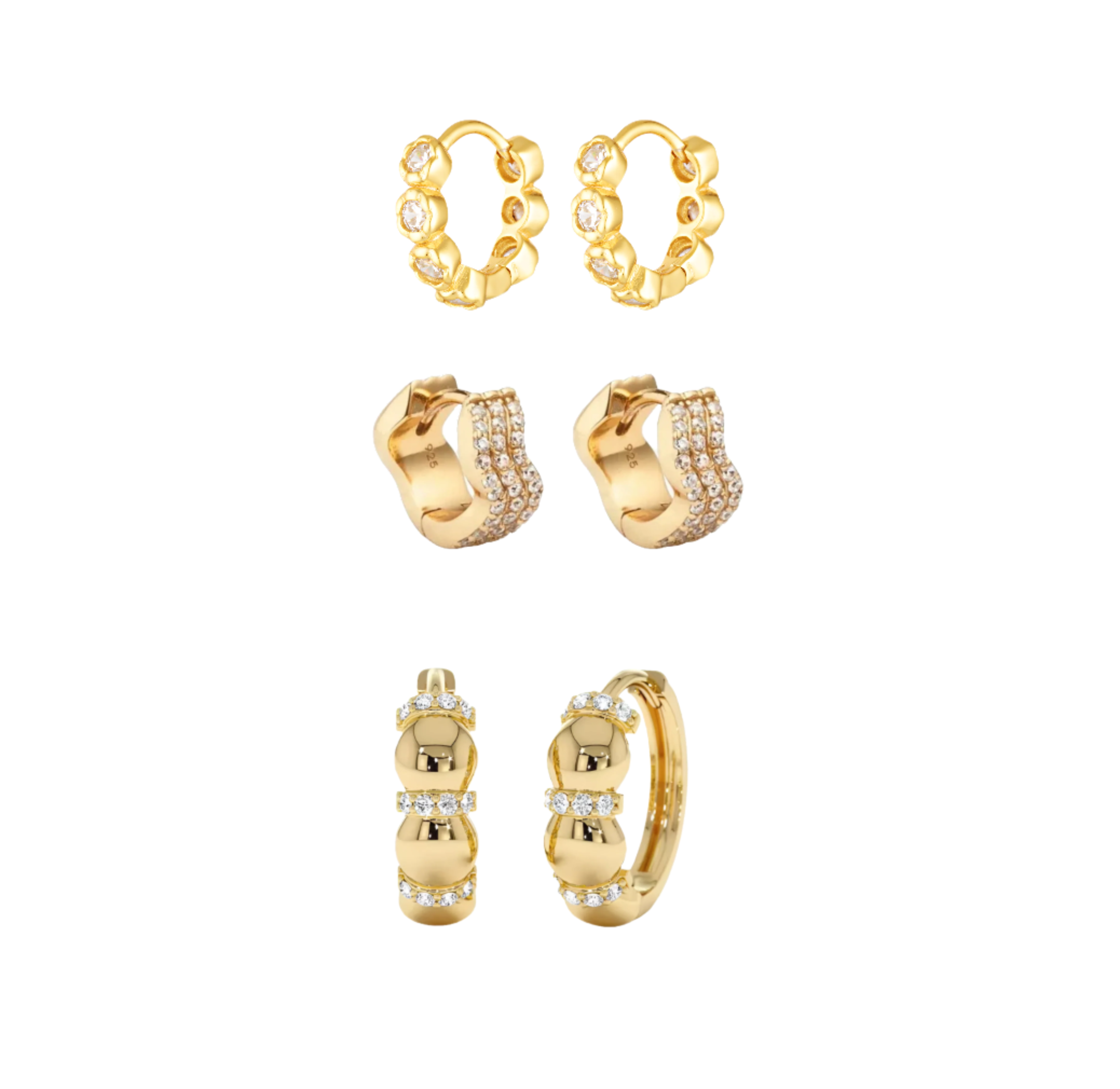 Set of gold hoop earrings with small diamonds on a white background