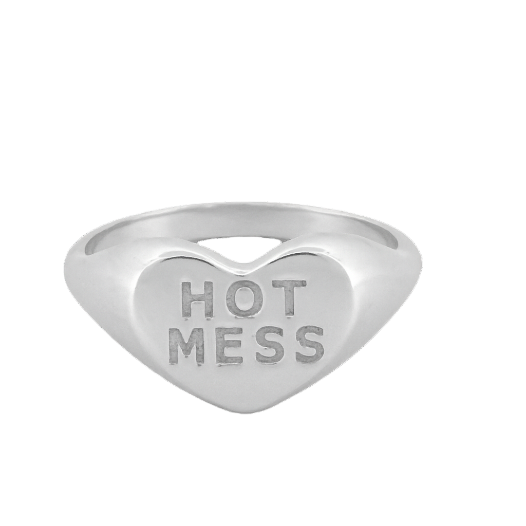 Heart-shaped silver ring with 'HOT MESS' engraving on a white background