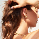 Model in Bixby and Co coloured earrings