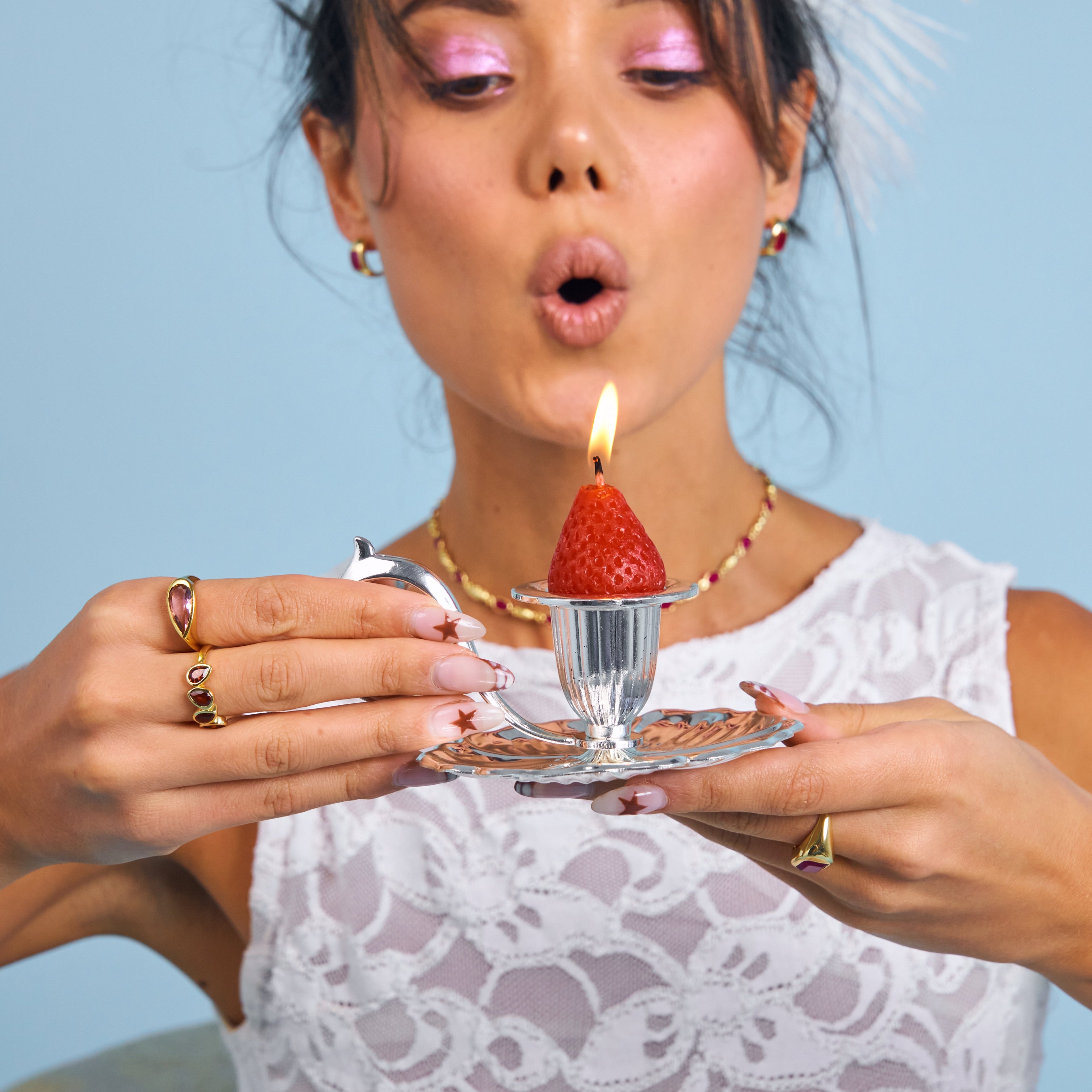 Cute photo of rings and strawberries with candle