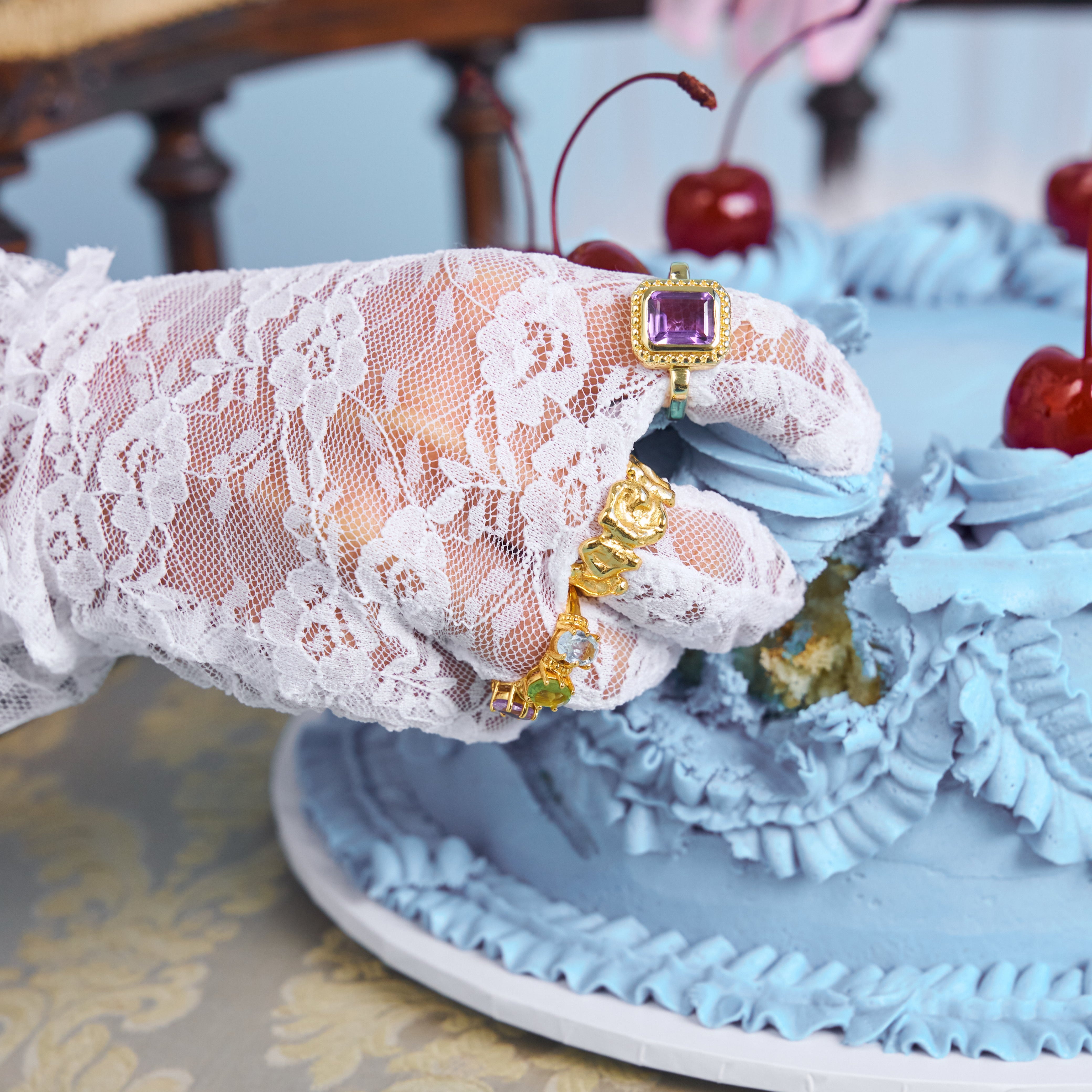 Bixby and Co new collection rings on a lace glove hand