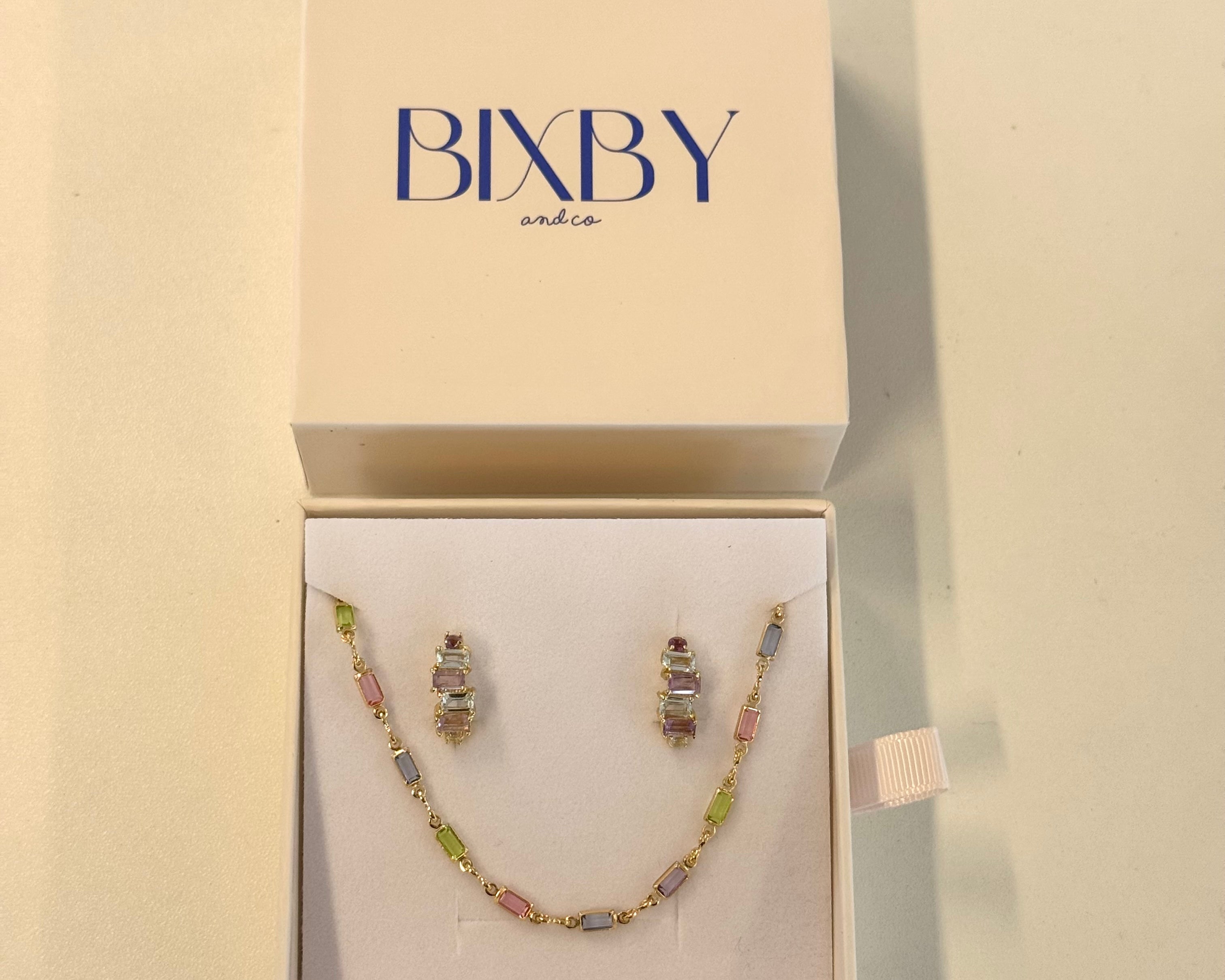 Jewelry set in a Bixby box on a beige background