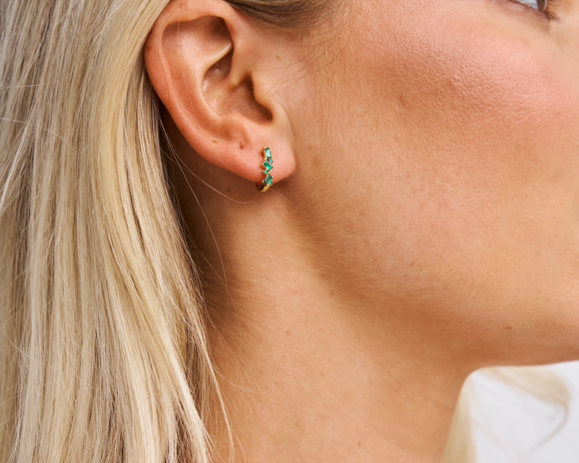 Model n small green gemstone huggies 