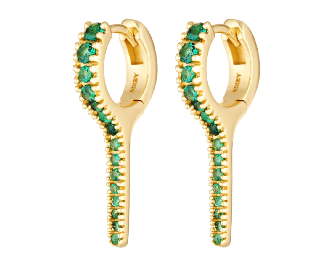 Gold hoop earrings with green gemstones on a white background