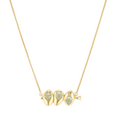 Gold necklace with three green gemstones on a white background