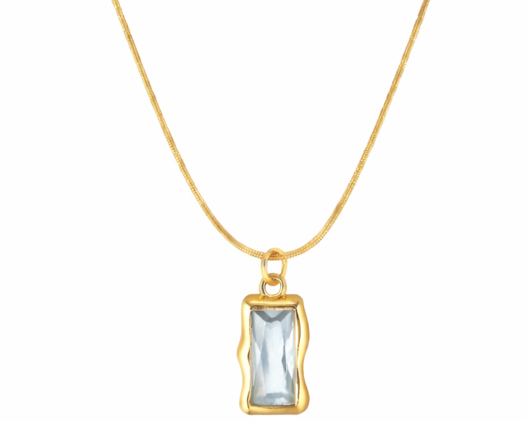 Gold necklace with a rectangular pendant on a white background