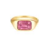 Gold ring with a pink gemstone on a white background