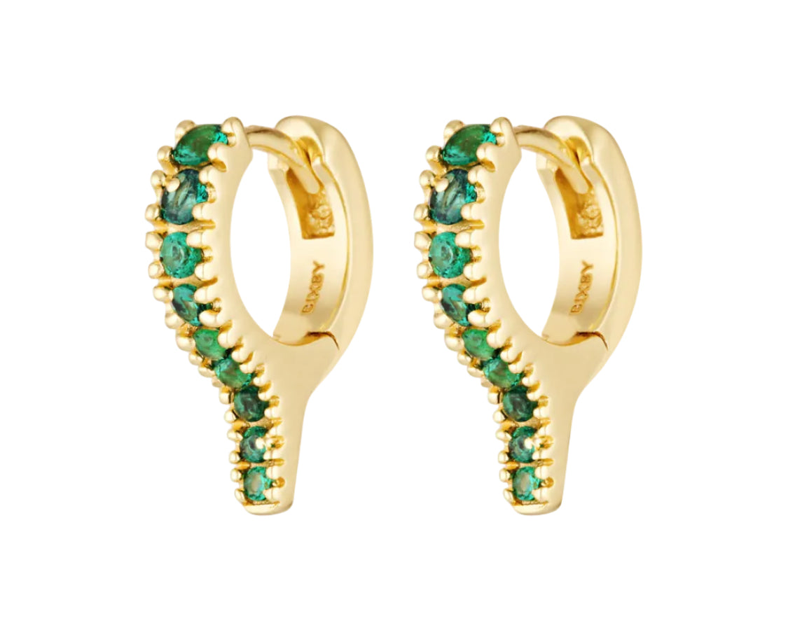Gold hoop earrings with green gemstones on a white background