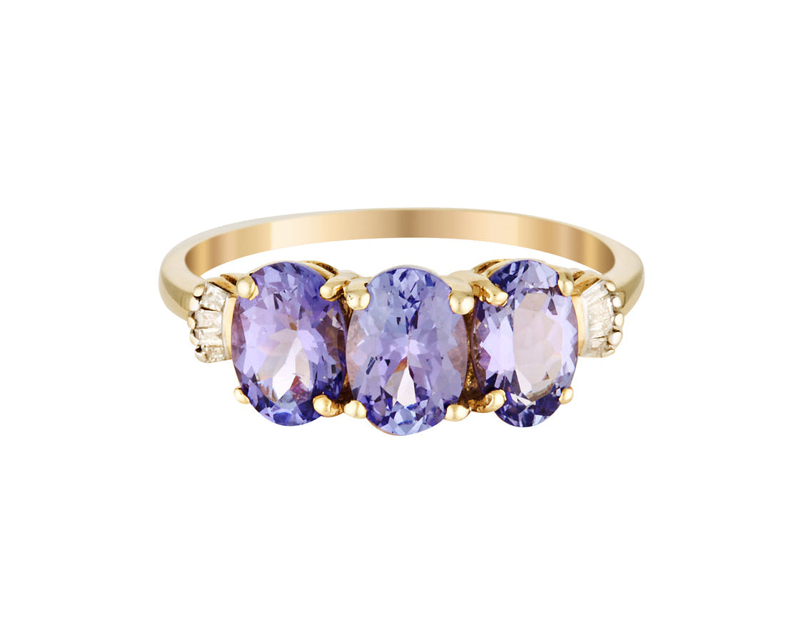 Gold ring with three oval purple amethyst gemstones on a white background