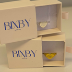 Bixby jewelry boxes with heart-shaped 'Hot Mess' rings inside