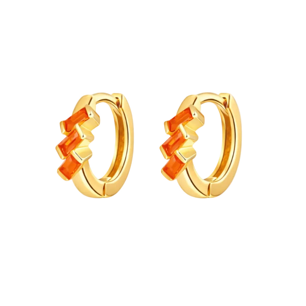 Gold hoop earrings with orange stones on a white background