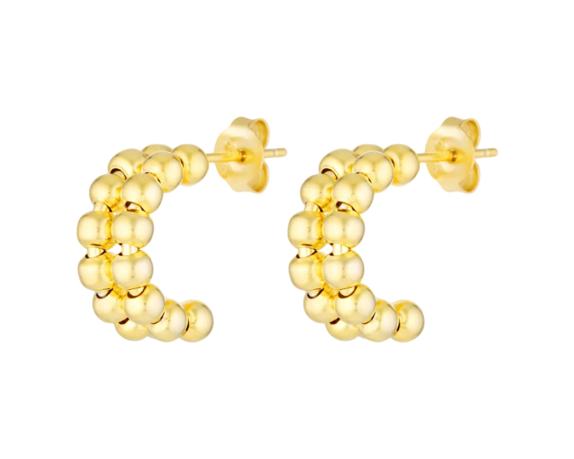 Gold hoop earrings on a white background