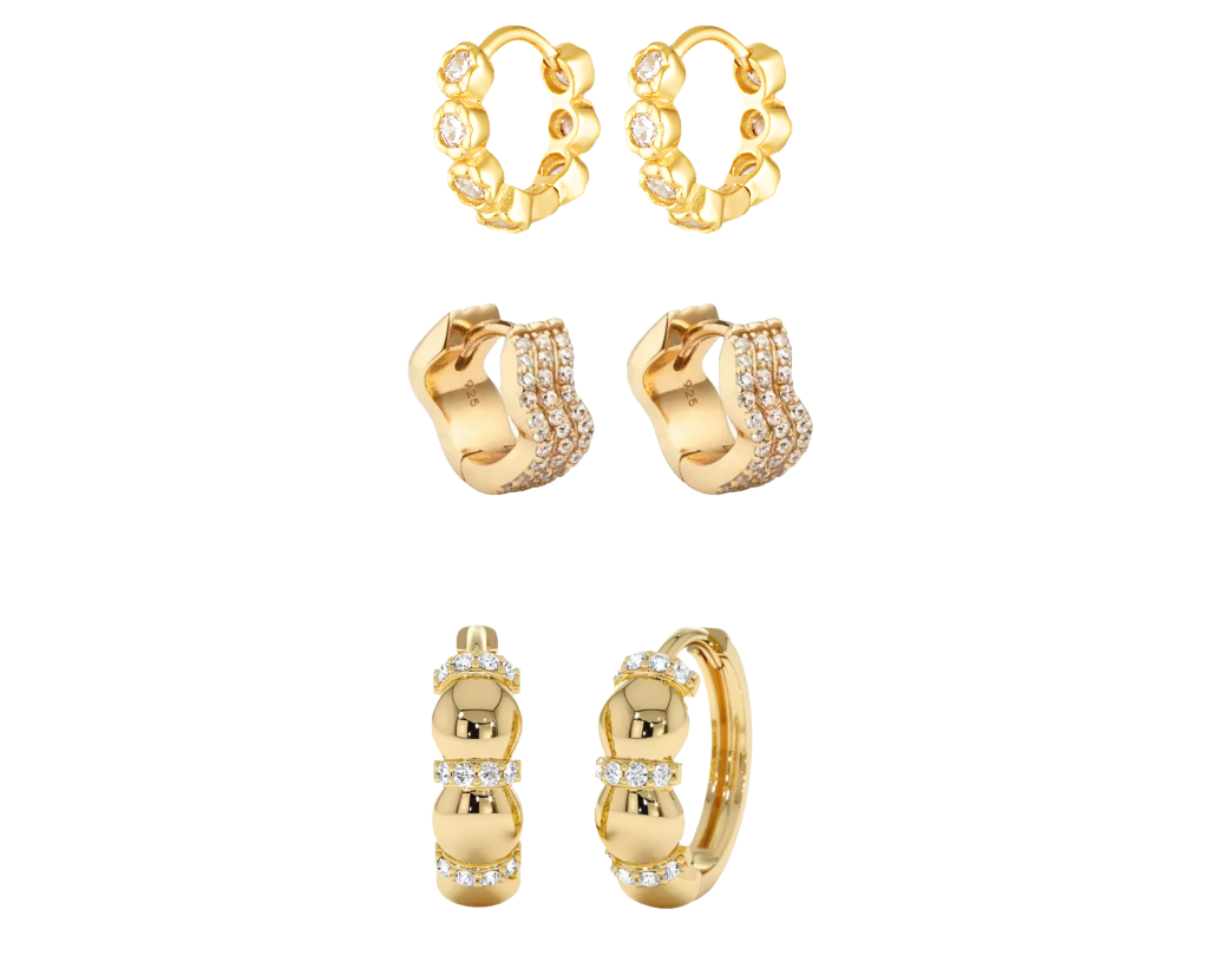 Set of gold hoop earrings with small diamonds on a white background