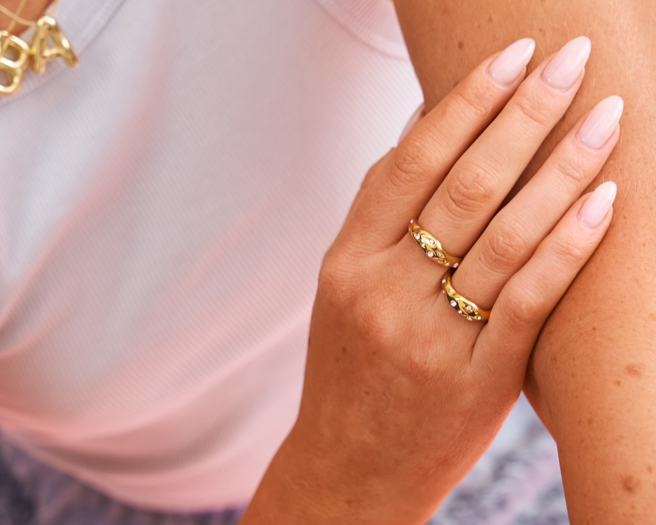 Wavy shaped 18k gold on stainless steel with clear crystal gems 