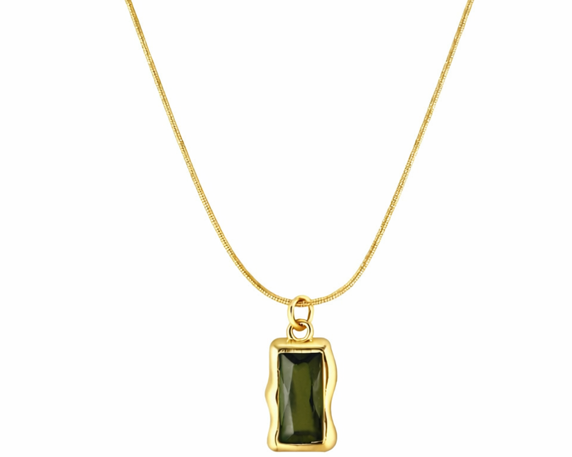 Gold necklace with a green pendant on a white background