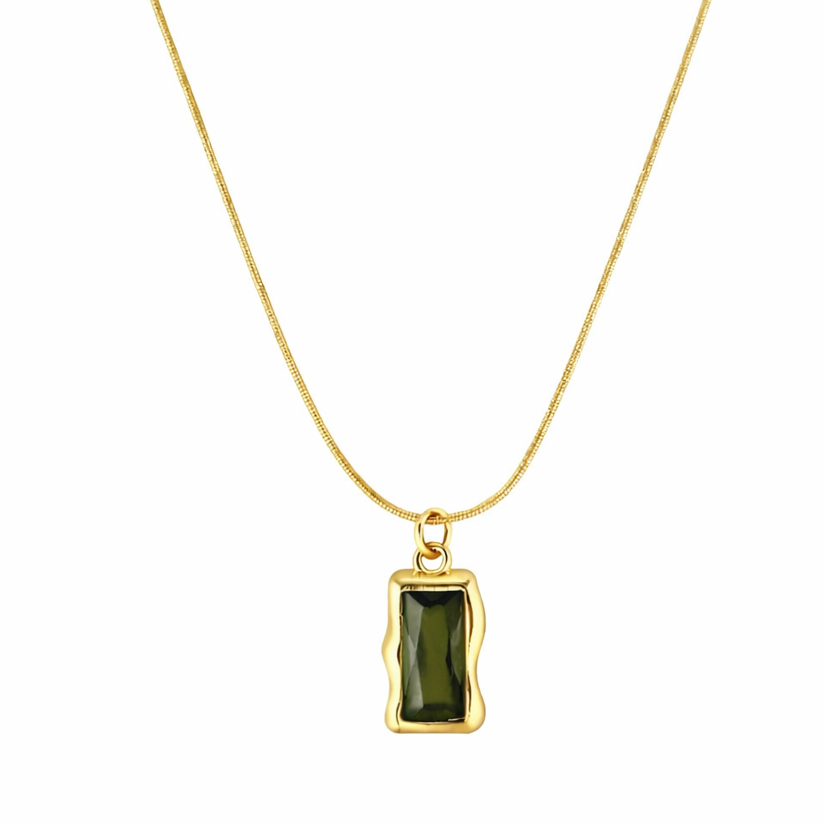 Gold necklace with a green pendant on a white background