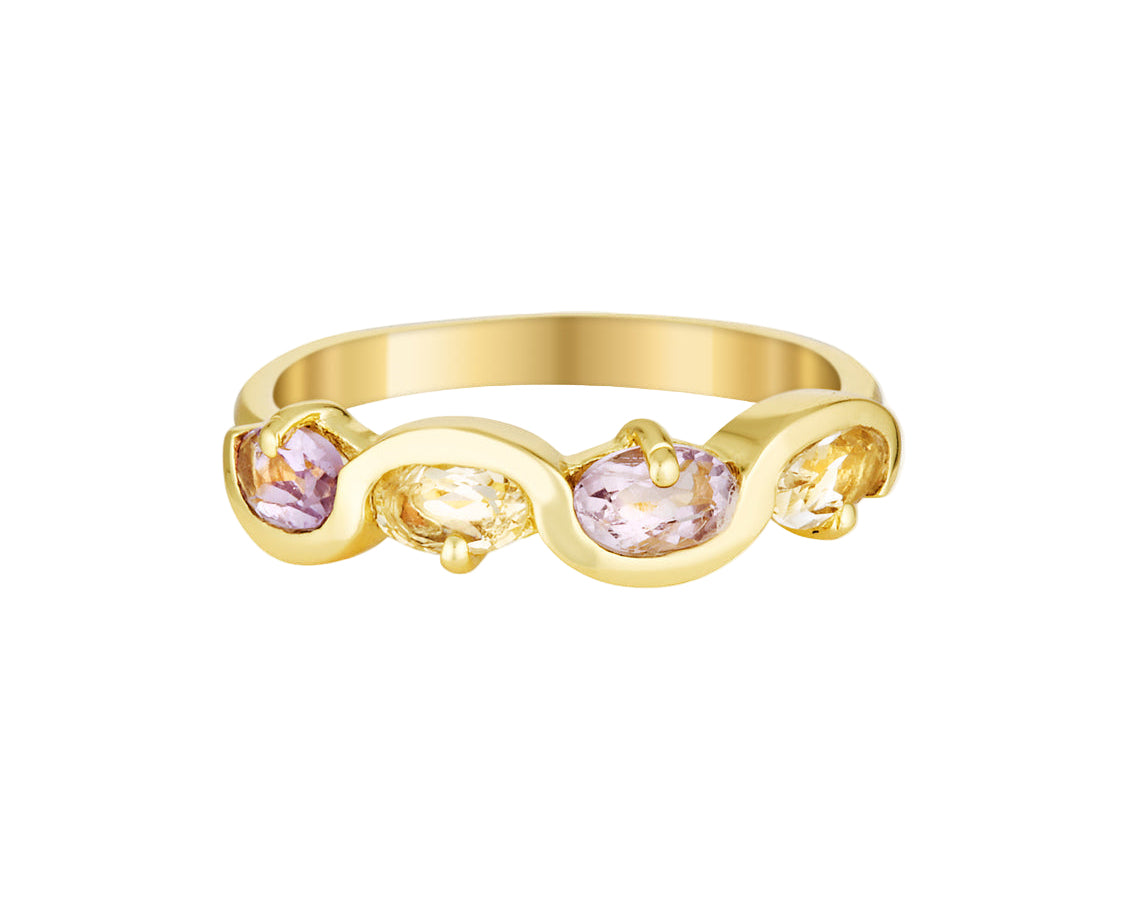 Gold ring with pink gemstones on a white background