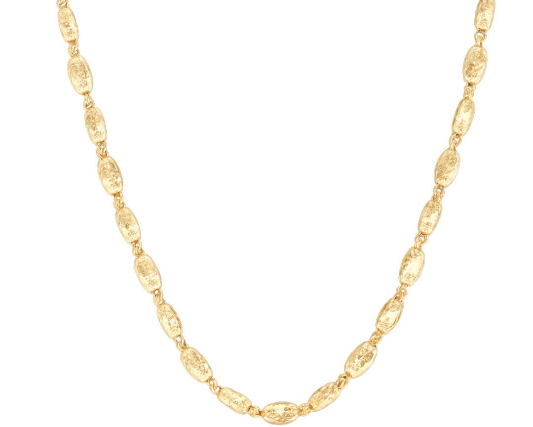 Gold chain necklace on a white background