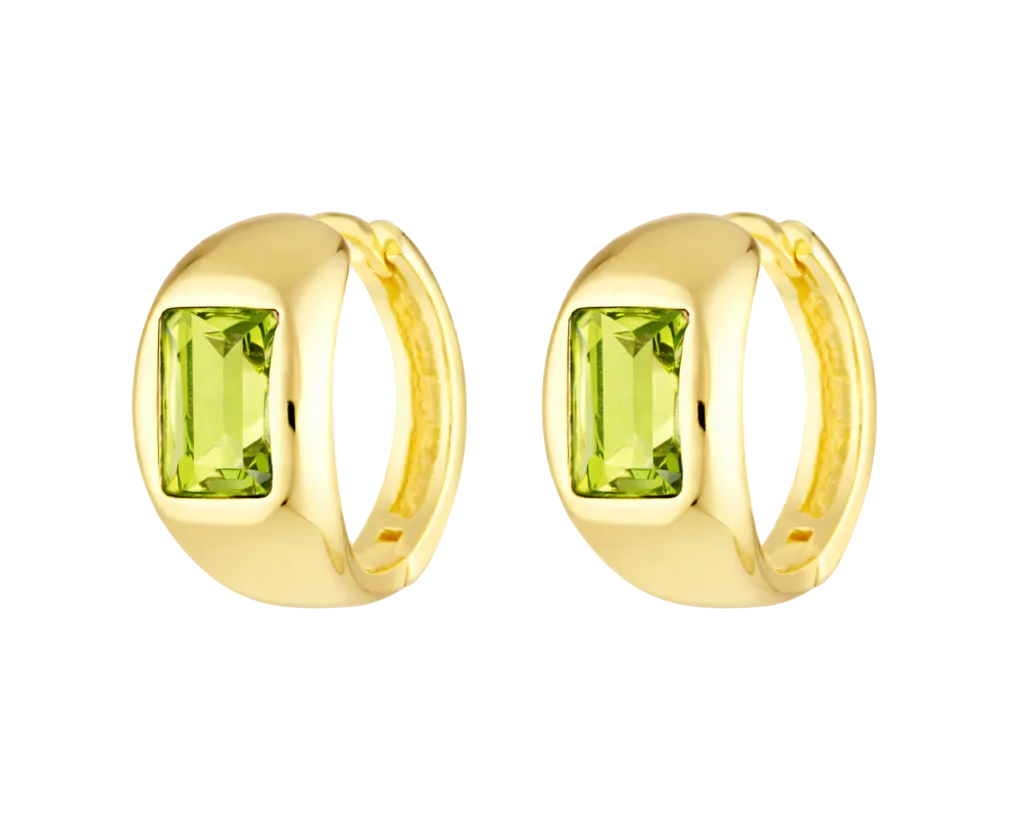 Gold hoop earrings with green gemstones on a white background