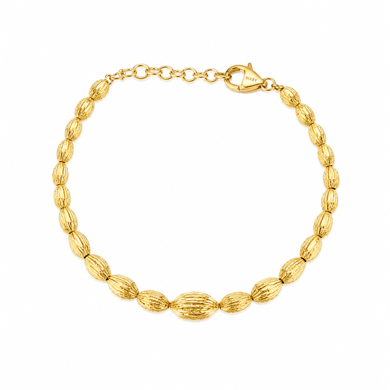 A gold beaded bracelet with textured, ribbed oval beads and a lobster clasp, displayed on a clean white background.