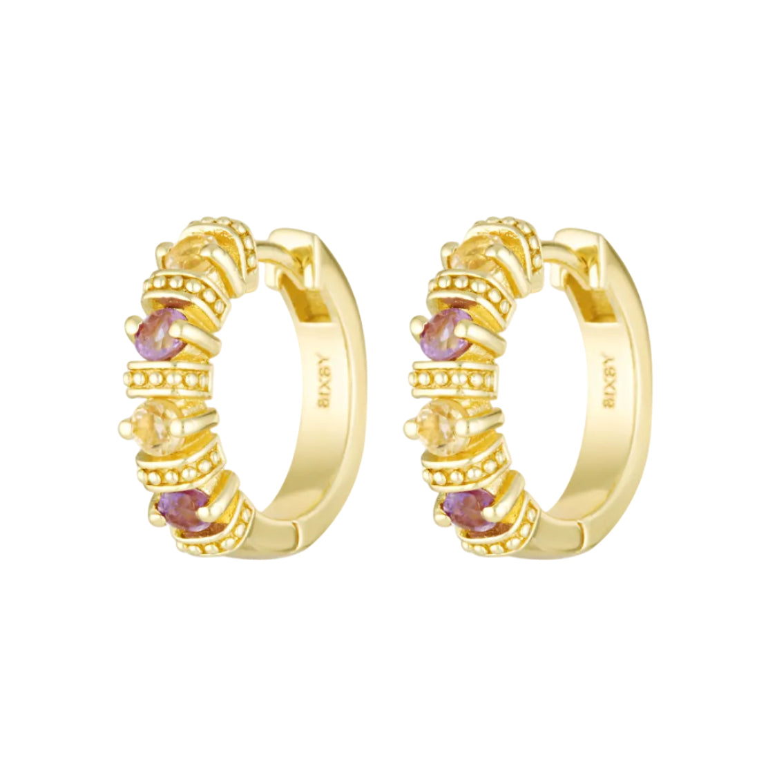 Gold hoop earrings with embedded gemstones on a white background