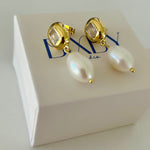 Pearl earrings on jewellery box 