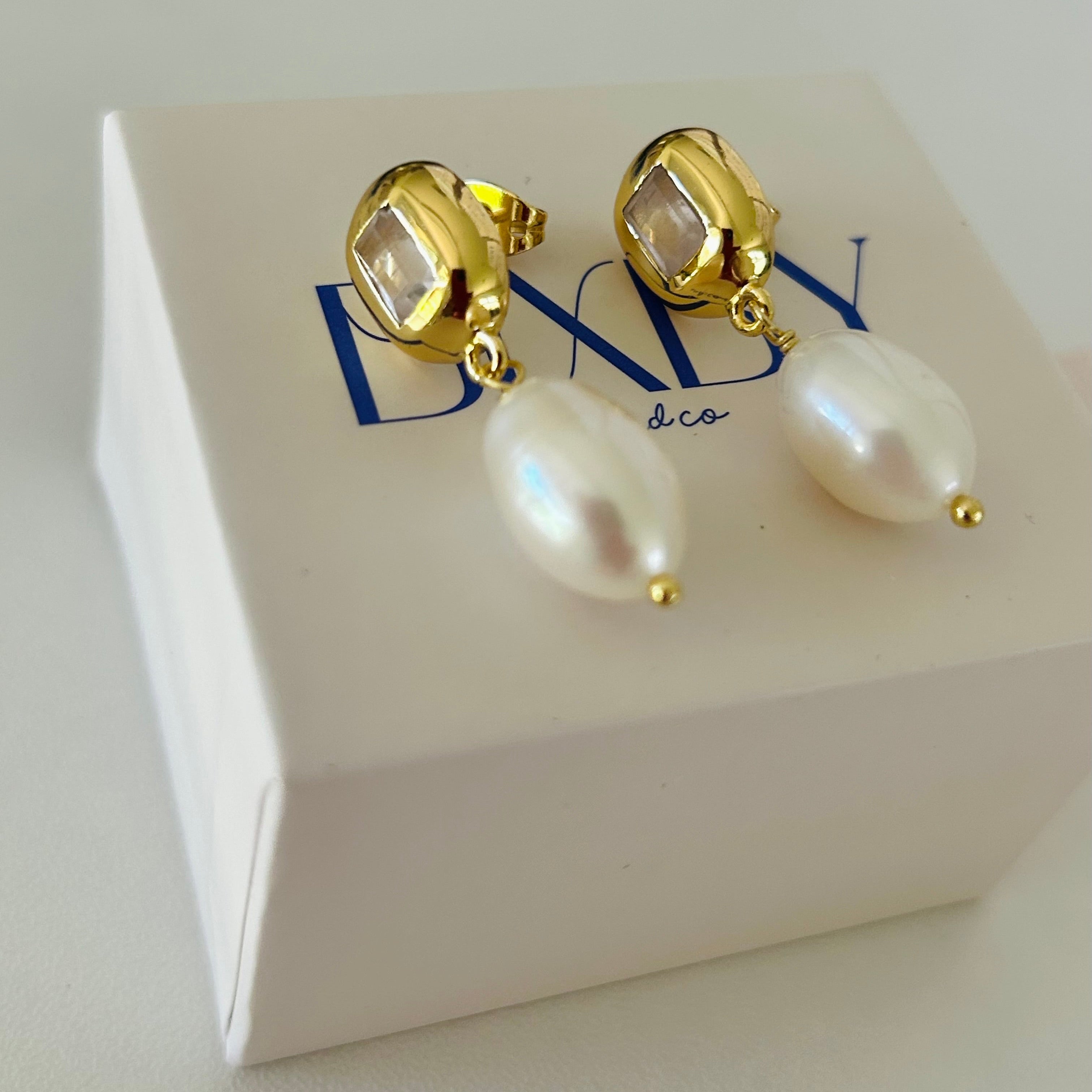 Pearl earrings on jewellery box 