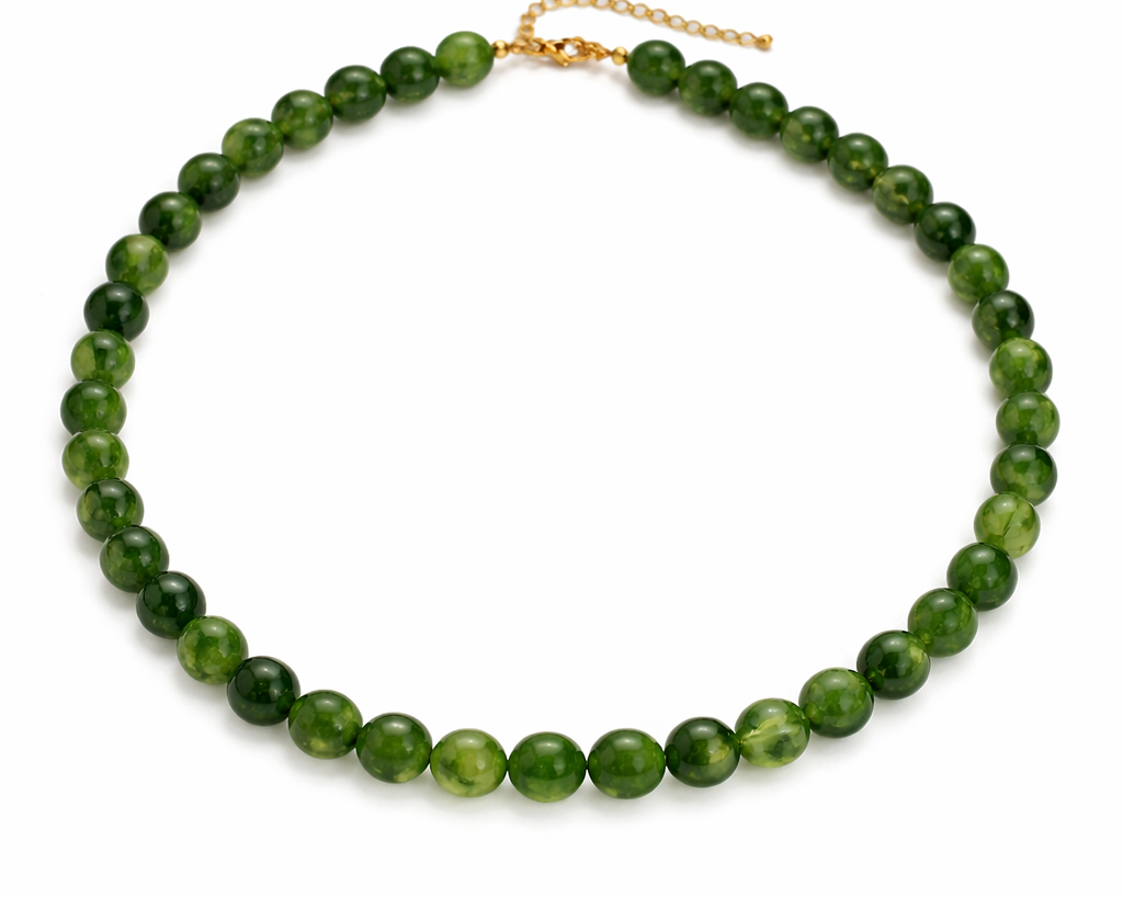 Green beaded necklace on a white background