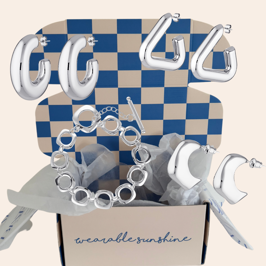 Silver mystery boxes with a selection of jewels