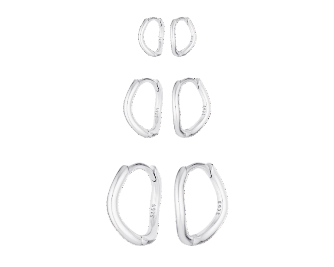 Set of silver hoop earrings on a white background