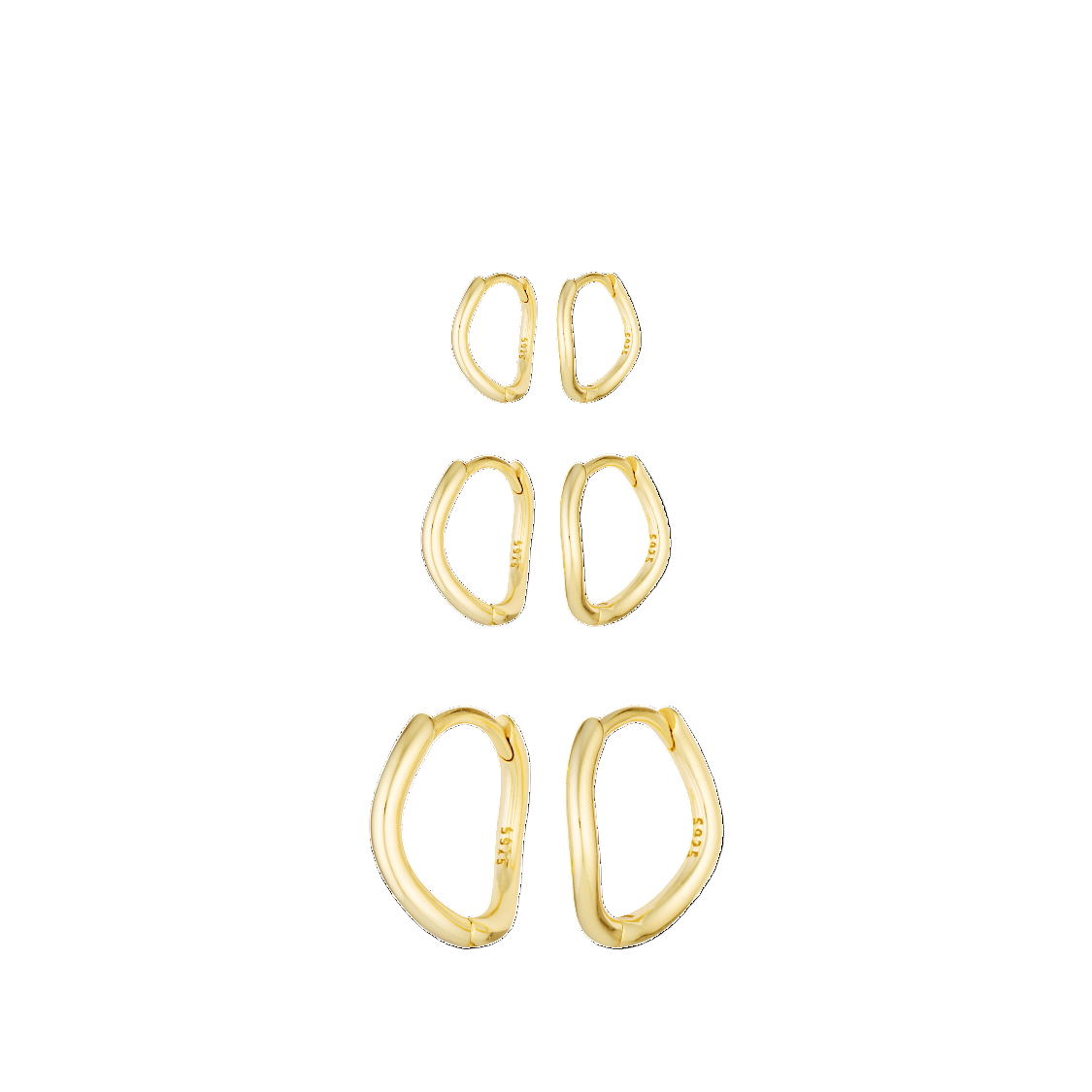 Set of gold hoop earrings on a white background