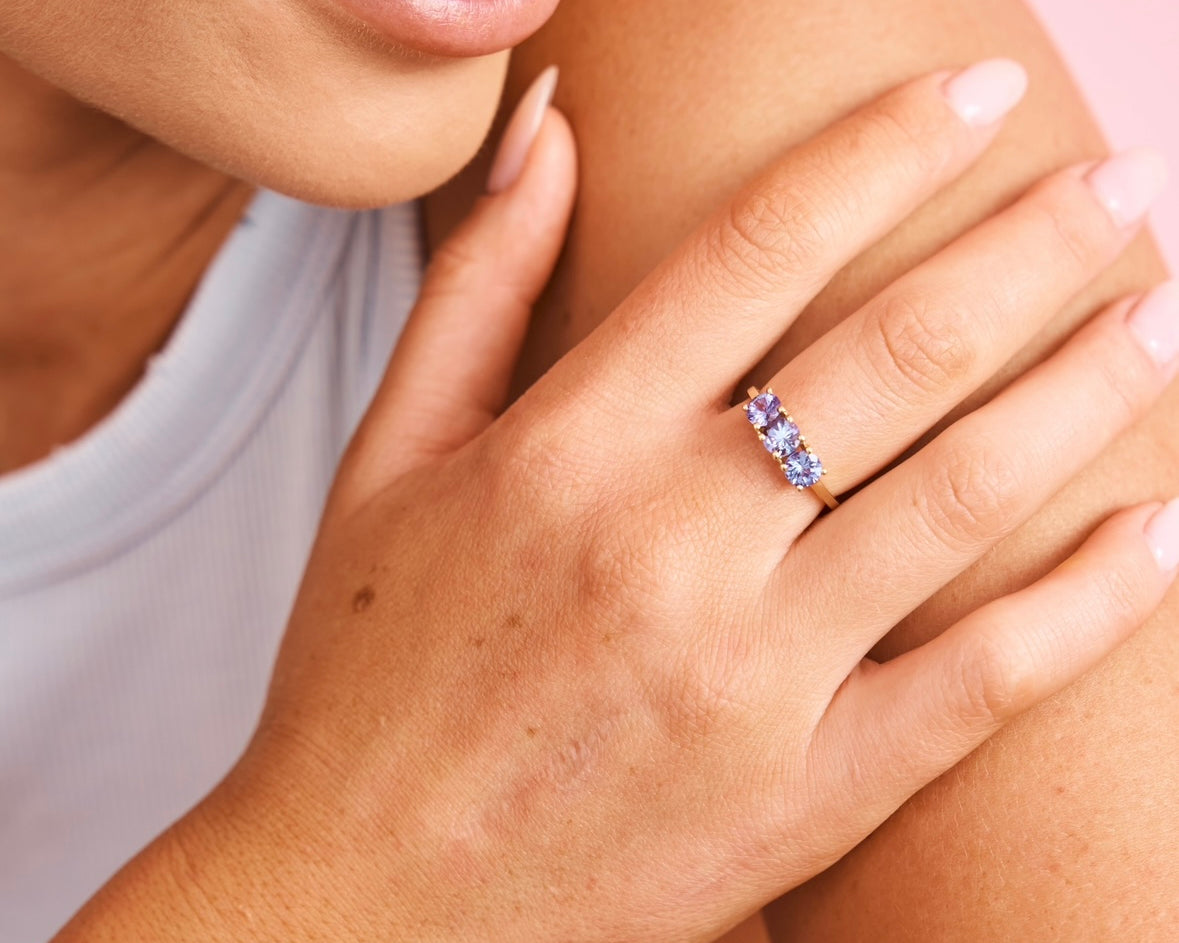 Dark blue topaz ring set in solid gold 