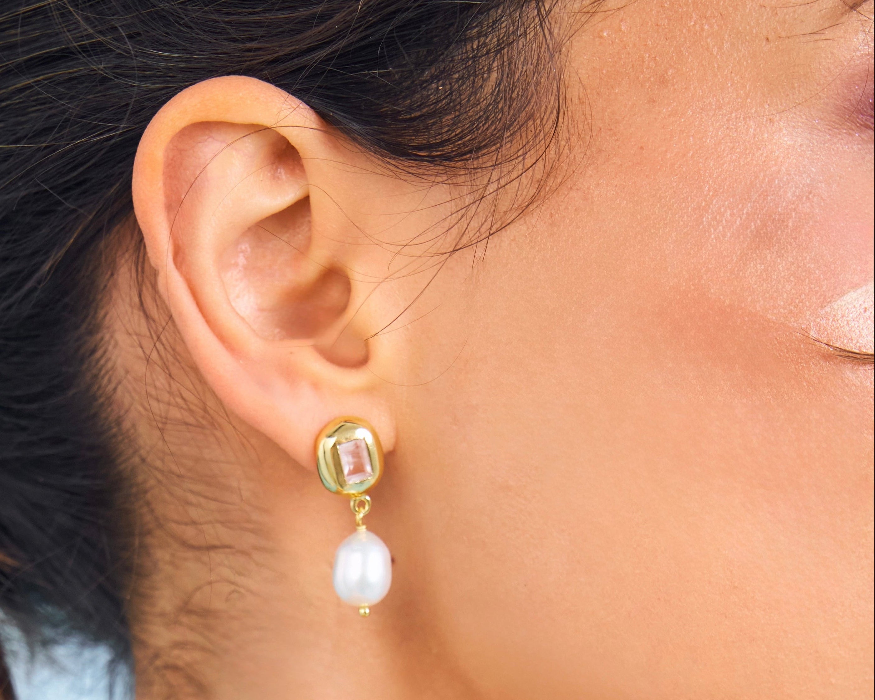 Close up of Pearl and pink gemstone earring from Bixby and Co