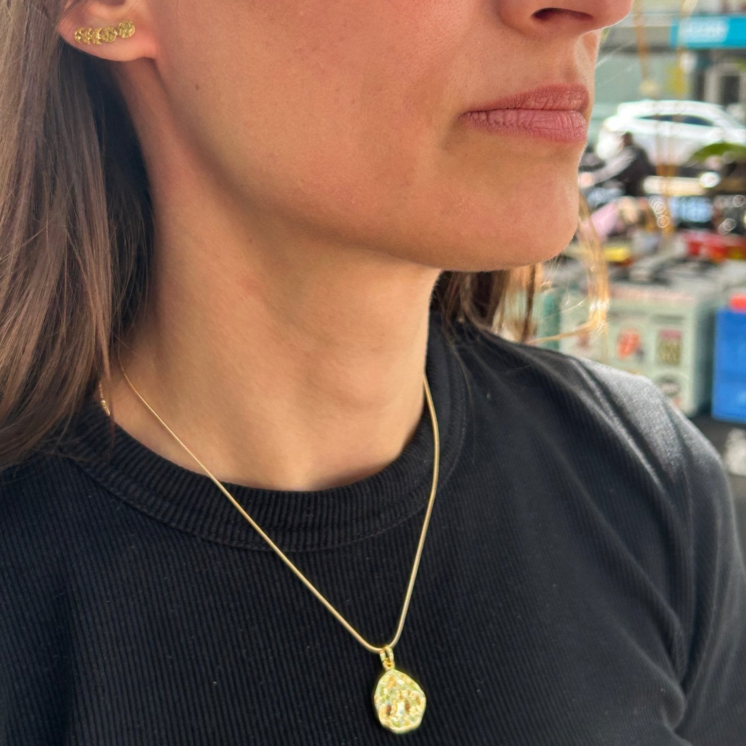 Girl wearing our vermeil gold pebble necklace 