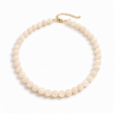 Pearl necklace with gold clasp on a white background