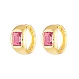 Gold hoop earrings with pink gemstones on a white background