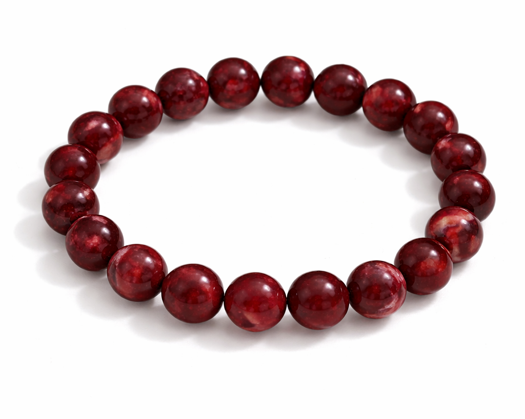 Red beaded bracelet on a white background