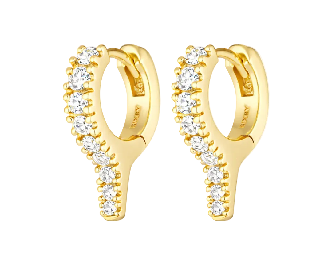 Gold hoop earrings with clear gemstones on a white background