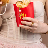 Gemma Ring on model with McDonalds packaging 