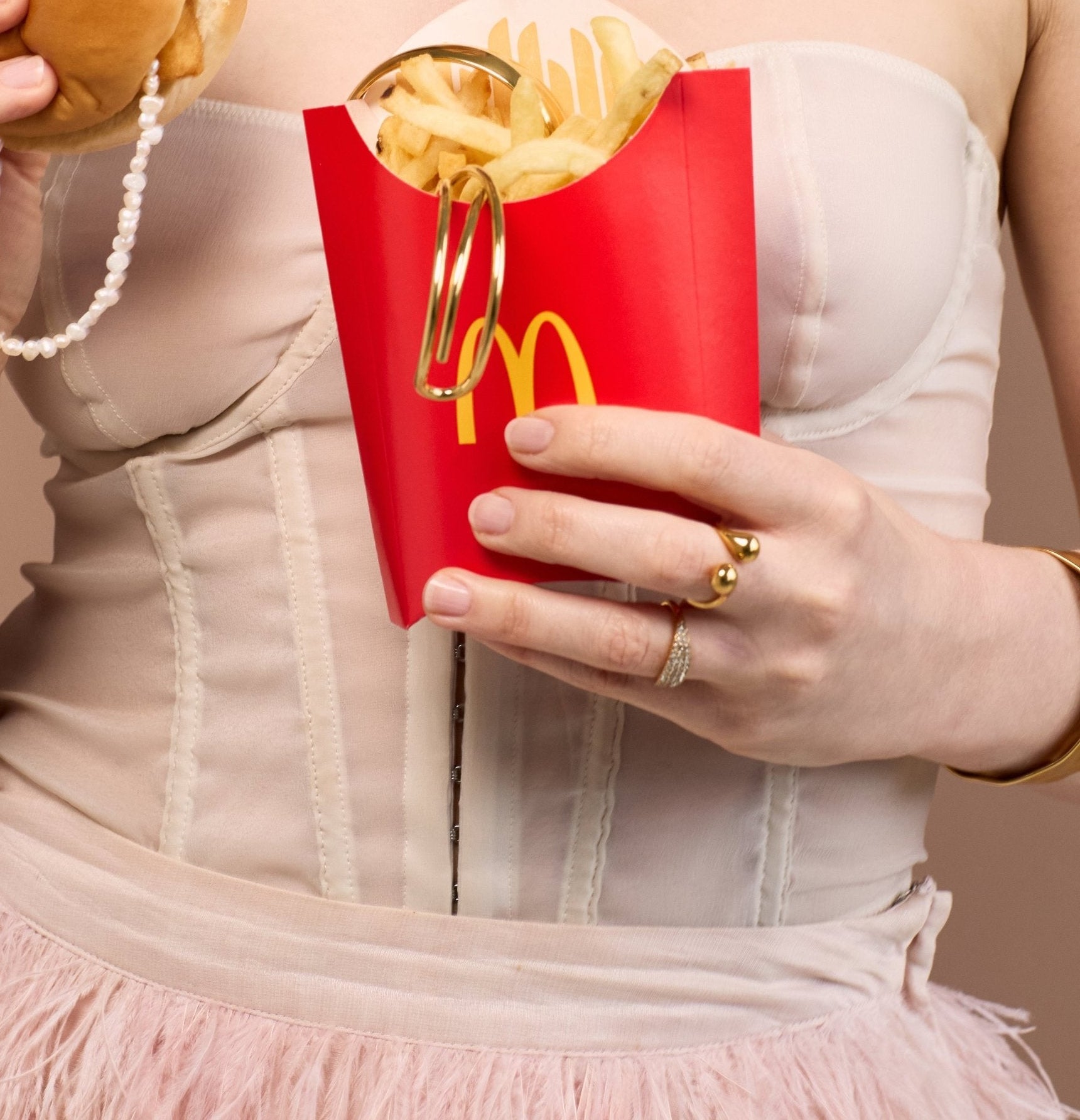 Gemma Ring on model with McDonalds packaging 