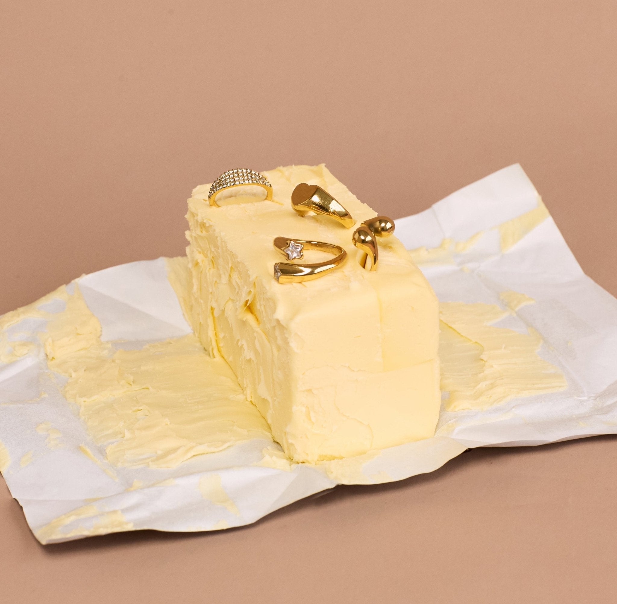New Champagne Collection jewellery isplayed in a stick of butter 