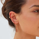 Model wearing red earring stack 