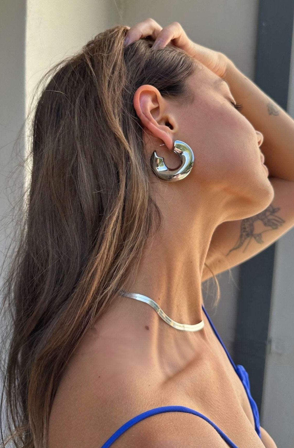 Model wearing our new big Swell hoops