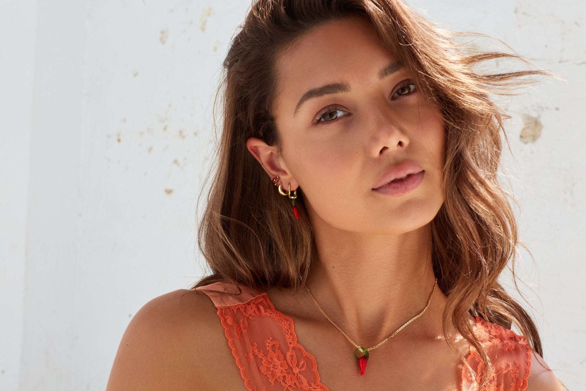 Chilli charms on necklace and wave hoops