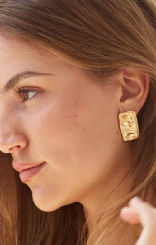 Model wearing gold Bixby earrings 