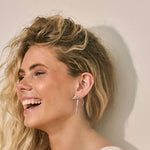 Model in Bixby and Co bow earrings